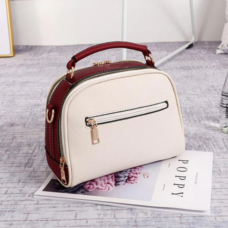 Bolsa Feminina em Couro Plutônio crossbody com alça transversal removível